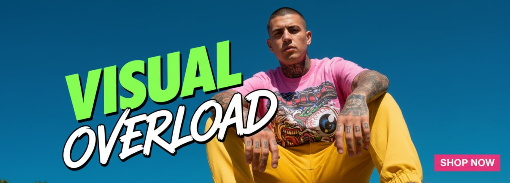 Person wearing a pink shirt and yellow pants with 'Visual Overload' text and 'Shop Now' button on a blue background